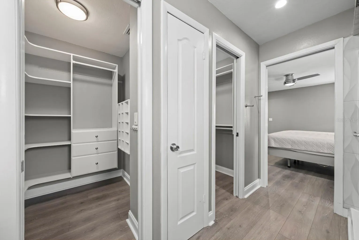 Primary bedroom 2 walk-in closets with linen closet.