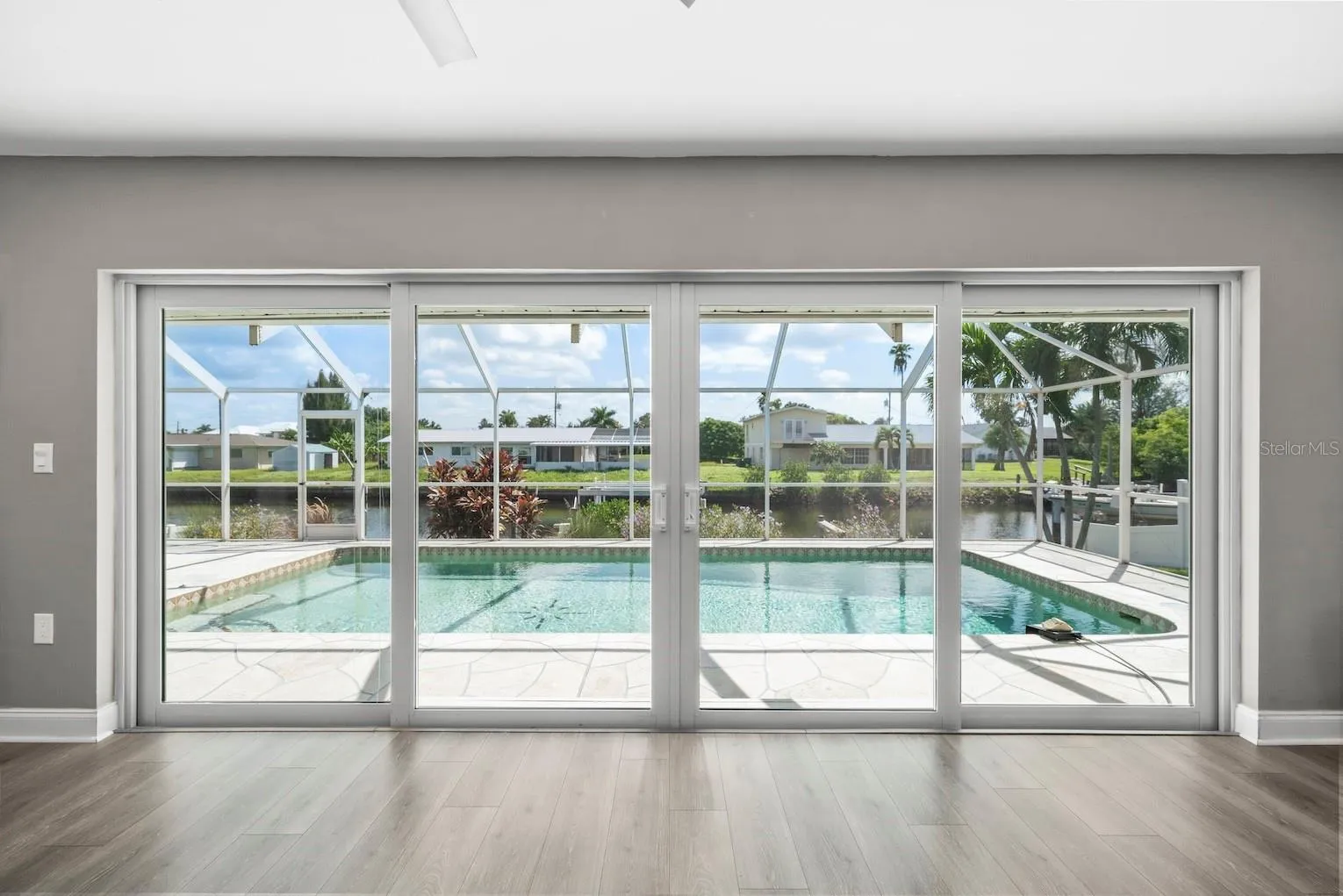 Impact sliding doors leading to pool / lanai.