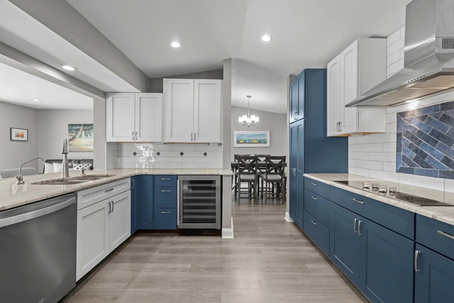 Highlighting updated kitchen with stainless steel appliances.