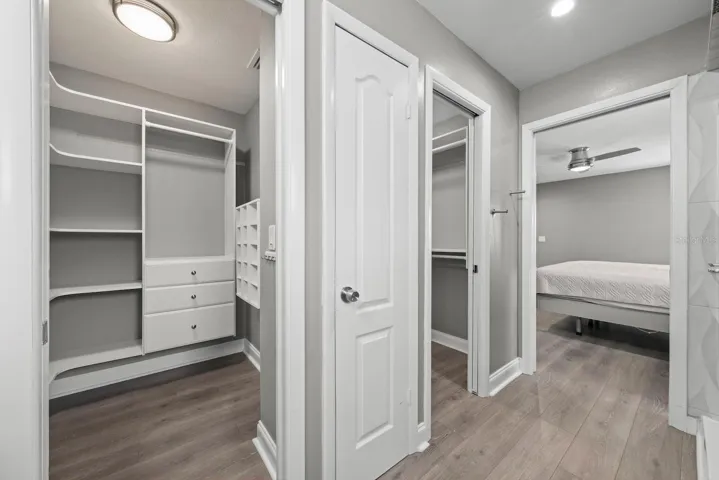 Primary bedroom 2 walk-in closets with linen closet.