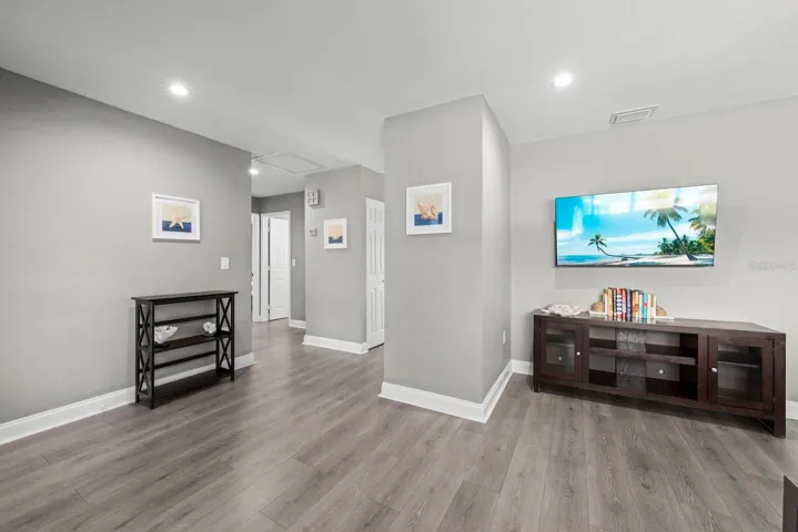 Hallway to guest bedrooms and front living room to the right.