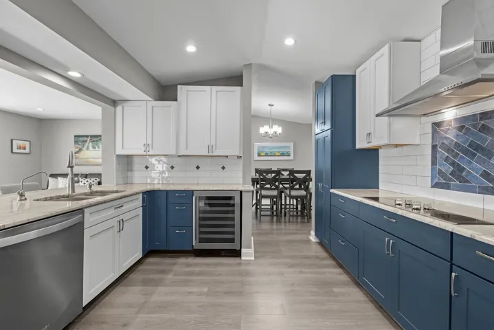 Highlighting updated kitchen with stainless steel appliances.