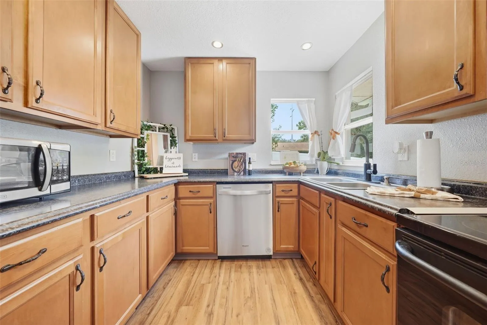 Kitchen Windows allow you to see the backyard while your making your favorite meal!
