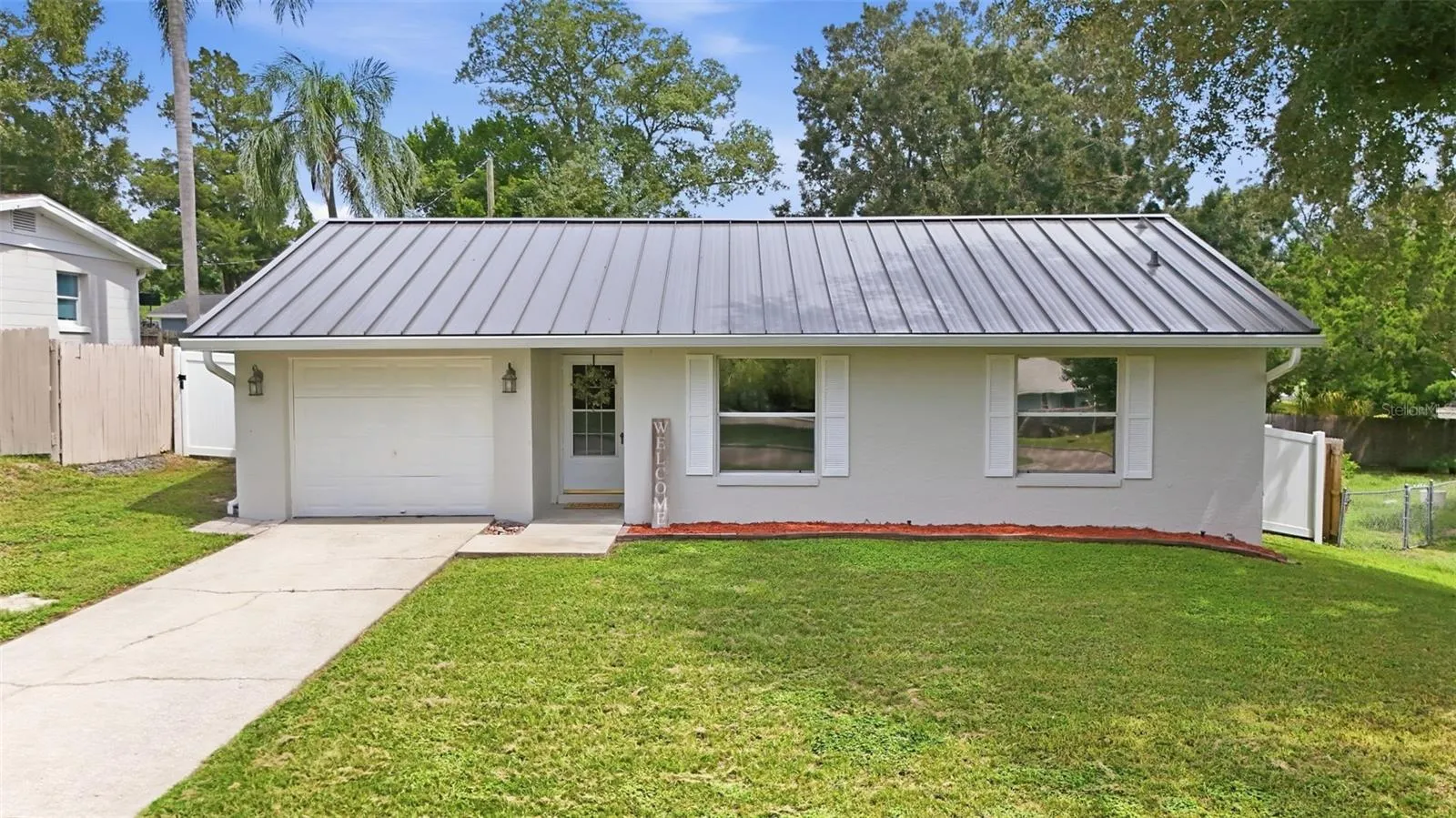 Concrete block home in adorable close to all amenities and the Turnpike.