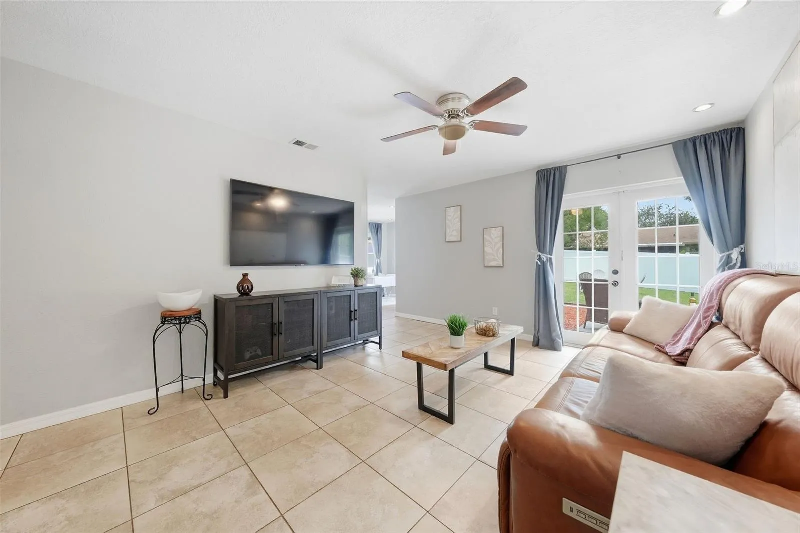 Enjoy watching your relaxing in your Living Room with the Double Doors open and the cool breeze!