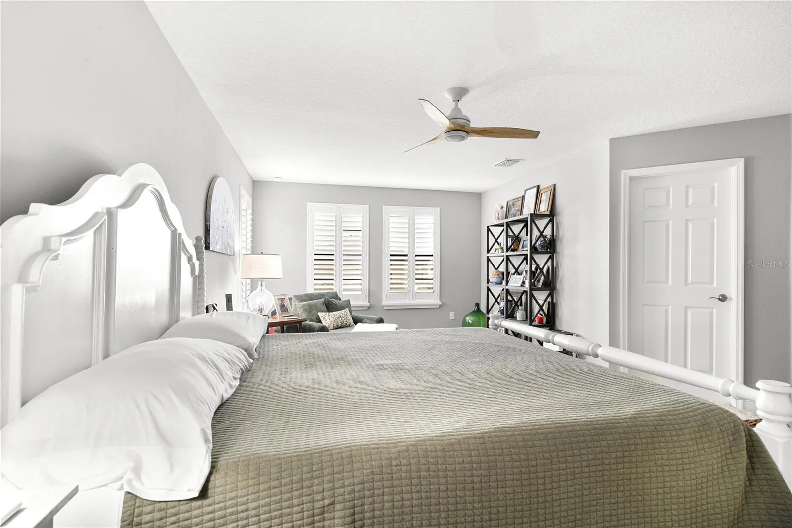 Primary bedroom with sitting area and bath ensuite