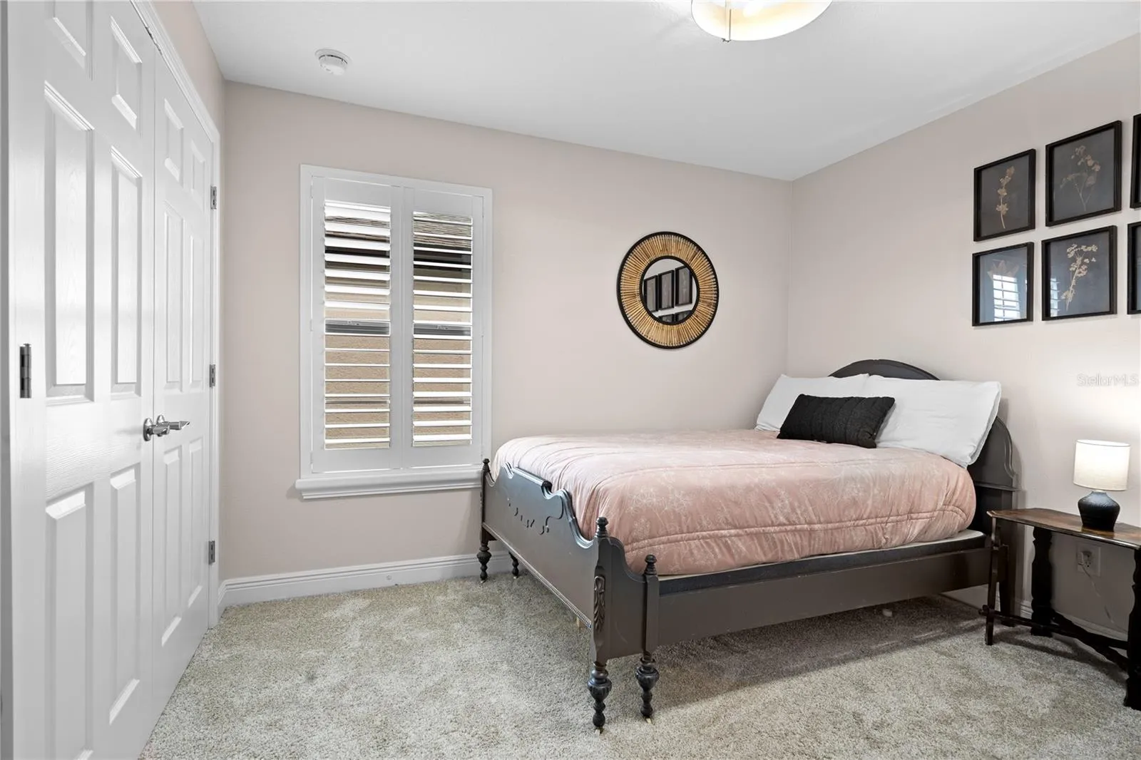 Guest bedroom upstairs with plantation shutters