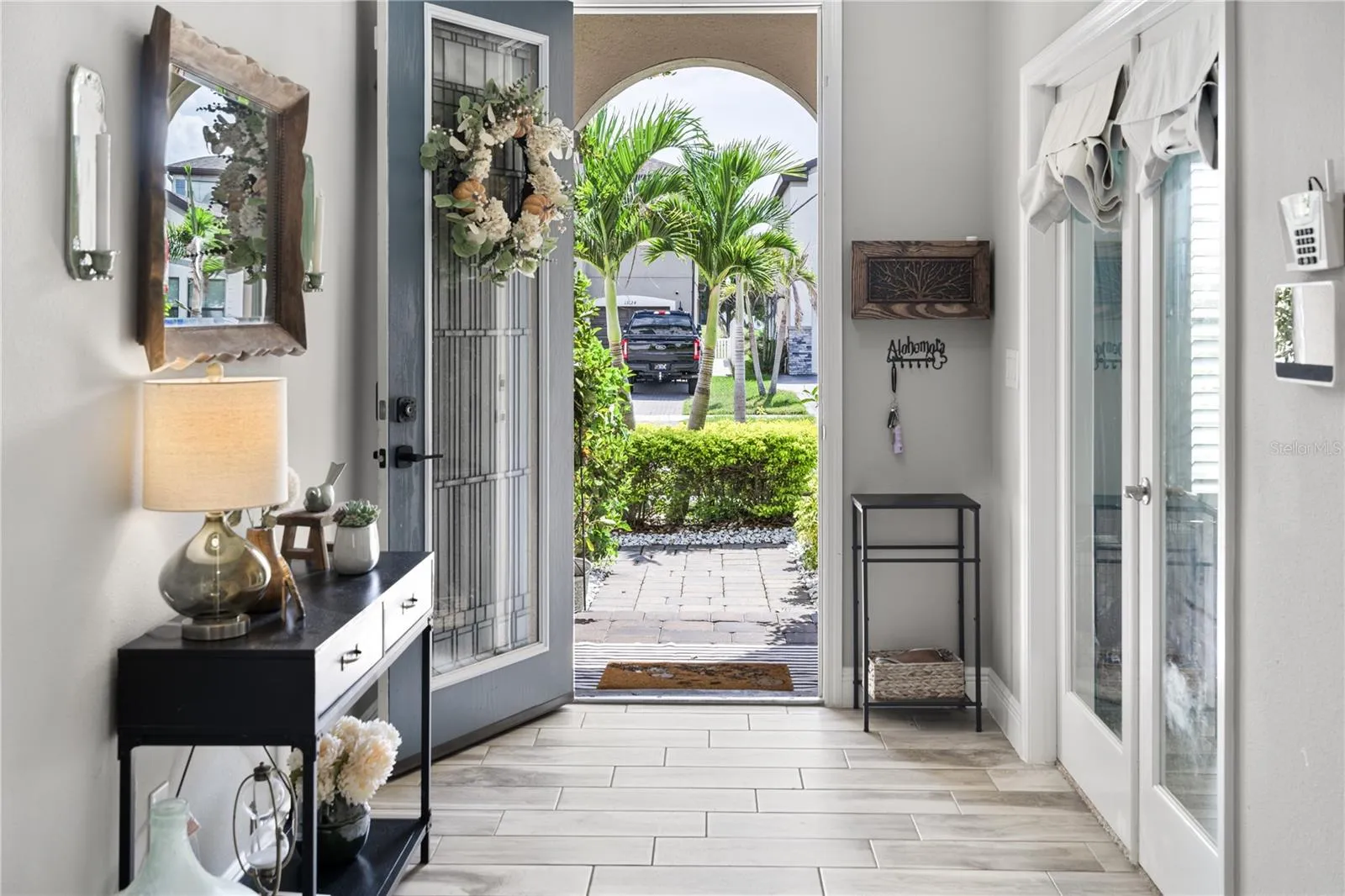 View from front door arched entry with paver walkway