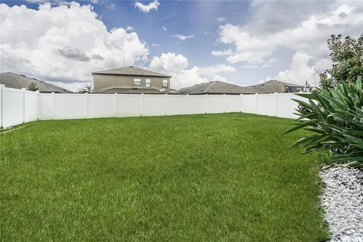 Grassy backyard with plenty of room for a pool