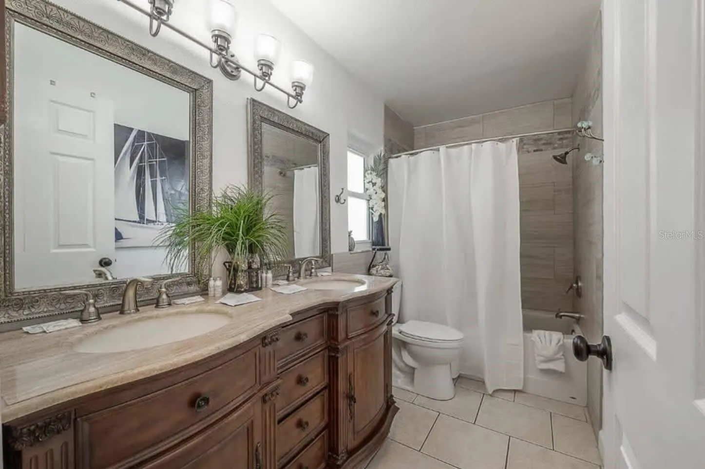 Remodeled guest bath with dual sink vanity