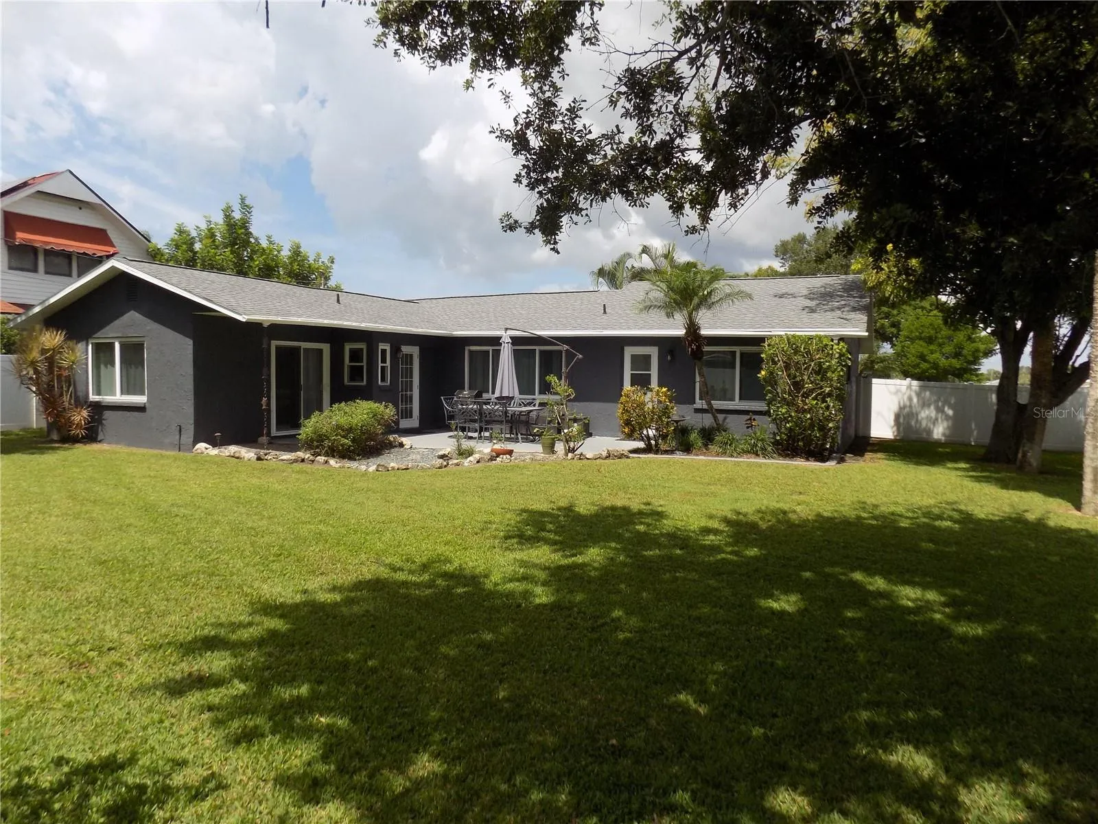 Alt. View: Back of home &amp; vinyl fenced back yard.