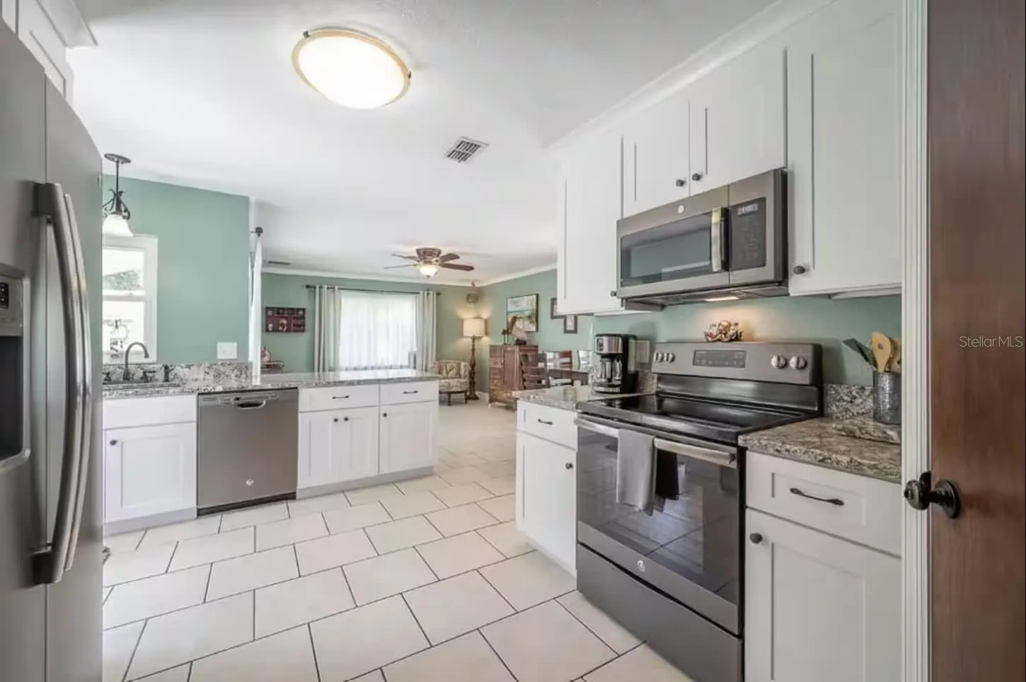 Kitchen with Granite Counters, GE appliances &amp; cown molding