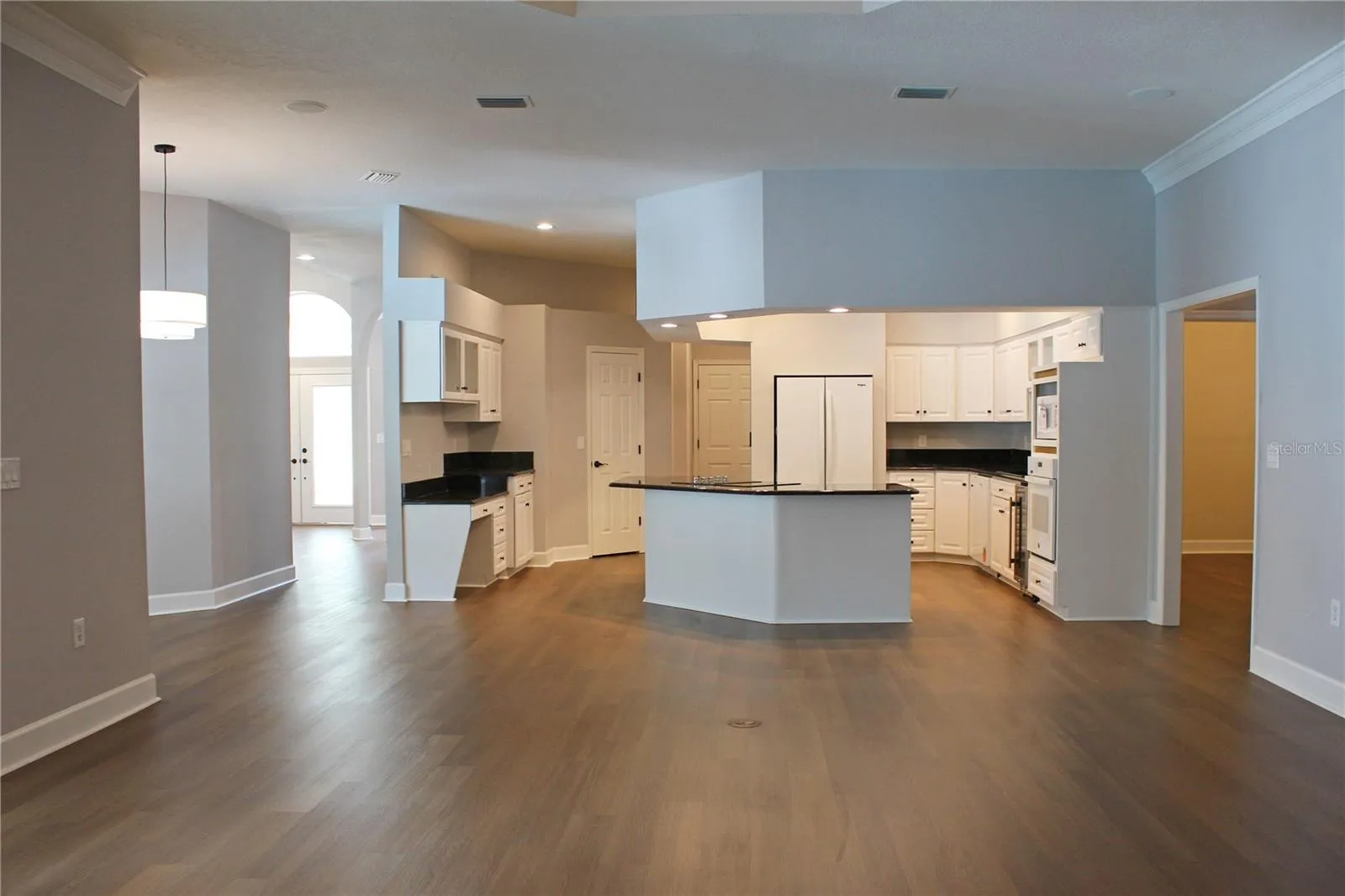 Great room showing kitchen, breakfast nook &amp; bar