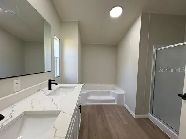 Primary BathroomDual SinksGranite topsBrand New soft close cabinets