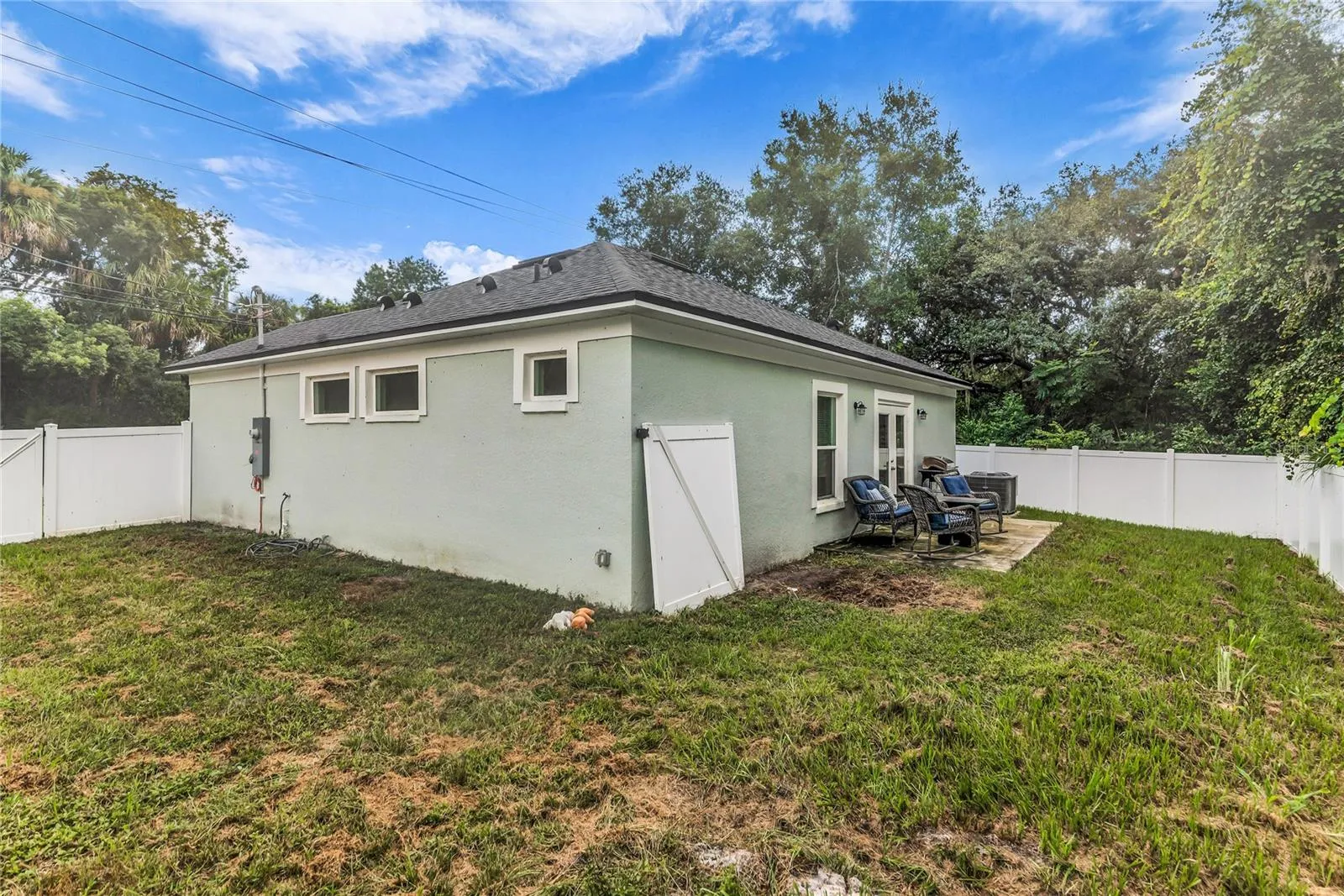 Fully fenced in back yard with storage shed