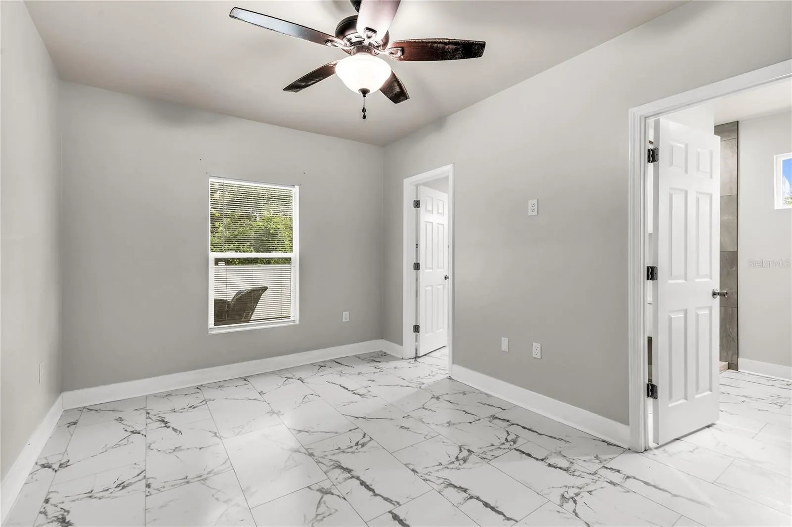 Primary bedroom with walk-in closet and ensuite bath
