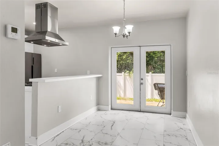 Dining Room with French doors leads to patio and fully fenced in back yard