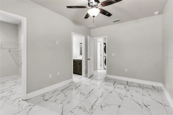 Primary bedroom with walk-in closet and ensuite bath
