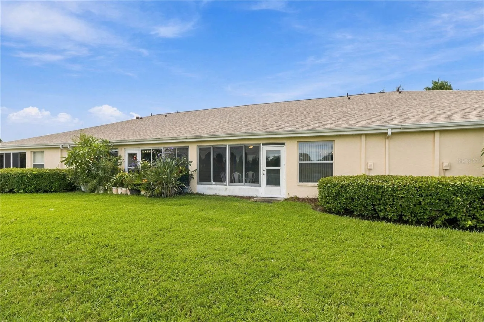 Rear view showcasing the home’s spacious outdoor living area