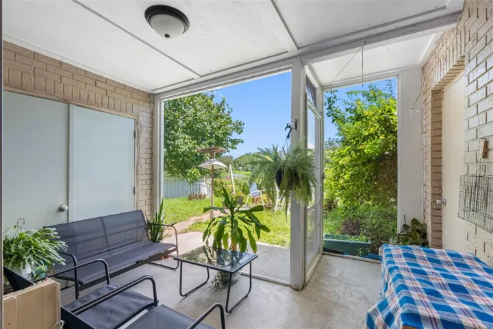 Screened Patio with Laundry Closet & Storage.