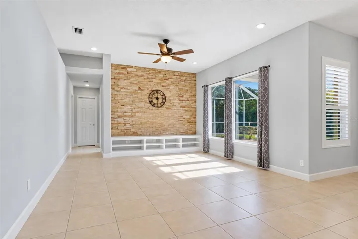 Family room has sliders to pool