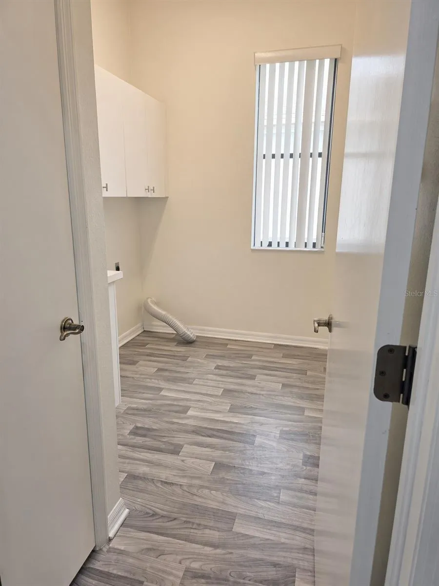 Laundry room with sink and closet