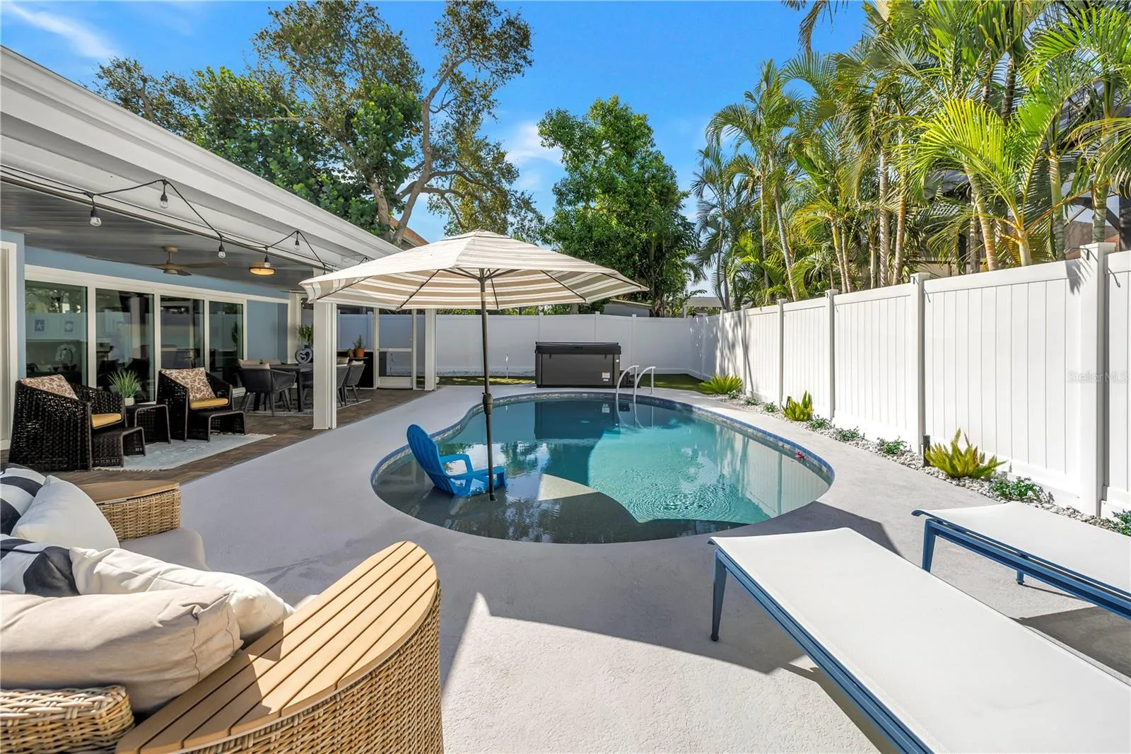 Heated AND Chilled six feet deep saltwater pool with sun shelf and umbrella option.