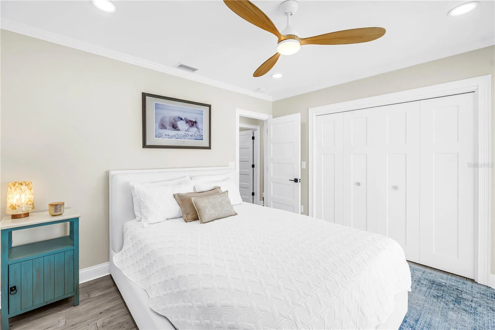 Second bedroom with custom closet built-ins.