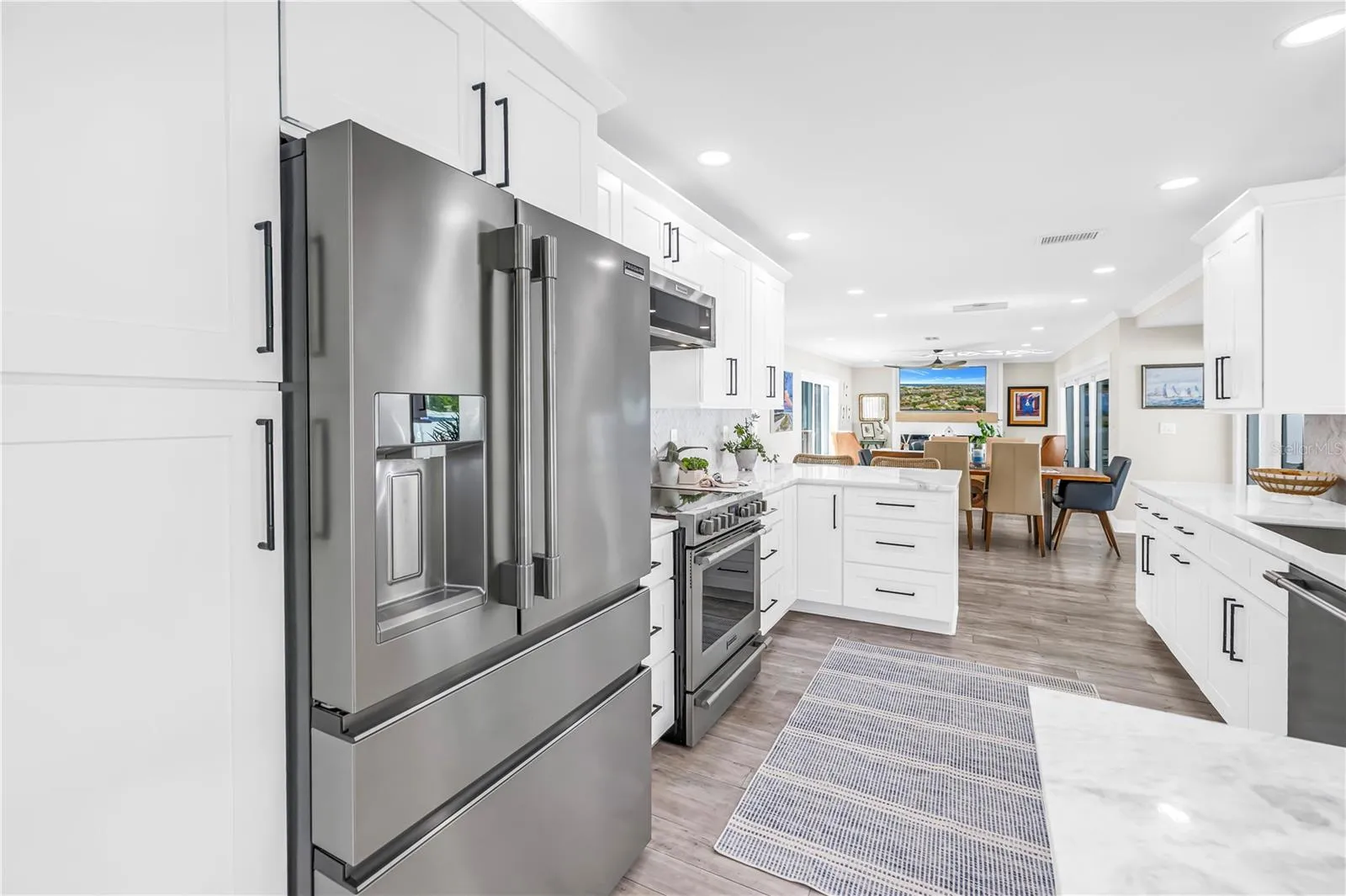 Stainless steel French style three drawer refrigerator and lots of panty space.