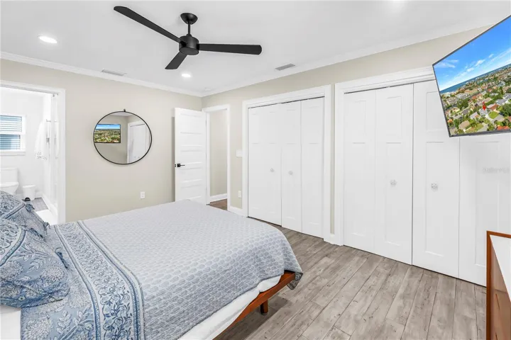 Double closets in Primary Suite with custom built in organizers.