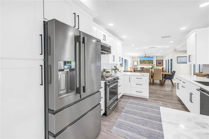 Stainless steel French style three drawer refrigerator and lots of panty space.