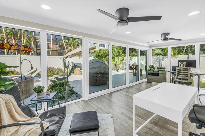 Beautiful light filled living space surrounded by impact rated double sliders.