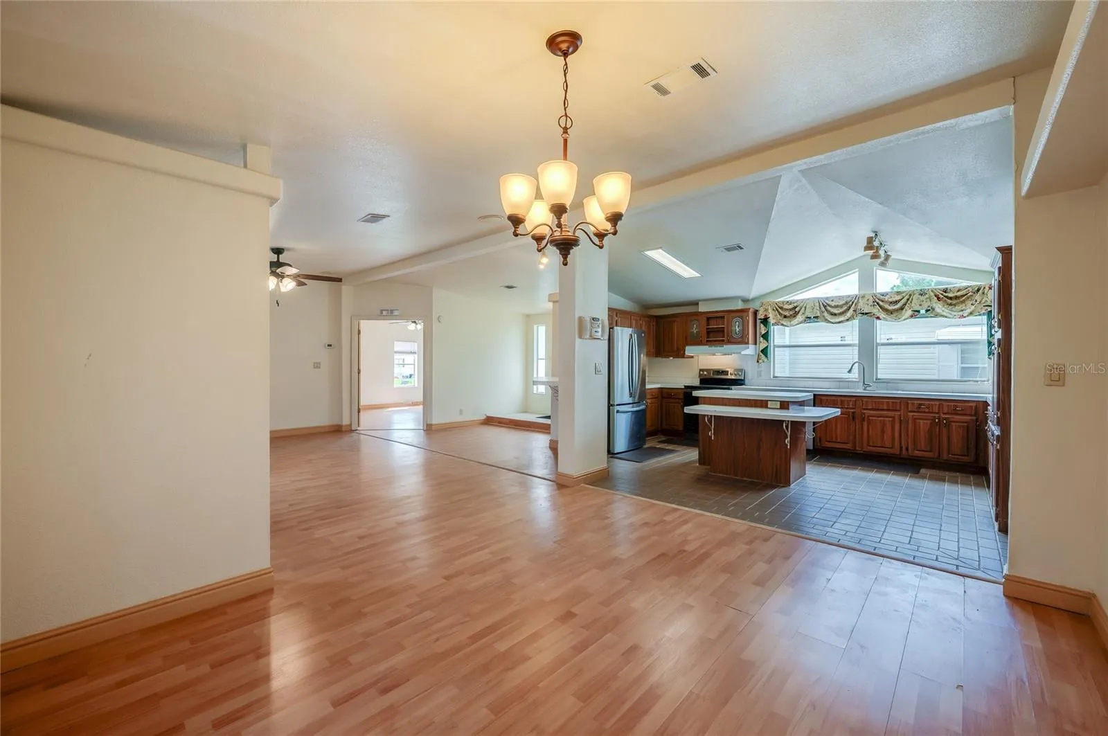 Open sightlines connect the dining area to the spacious kitchen, creating an easy flow between meal preparation, dining, and the main living space.