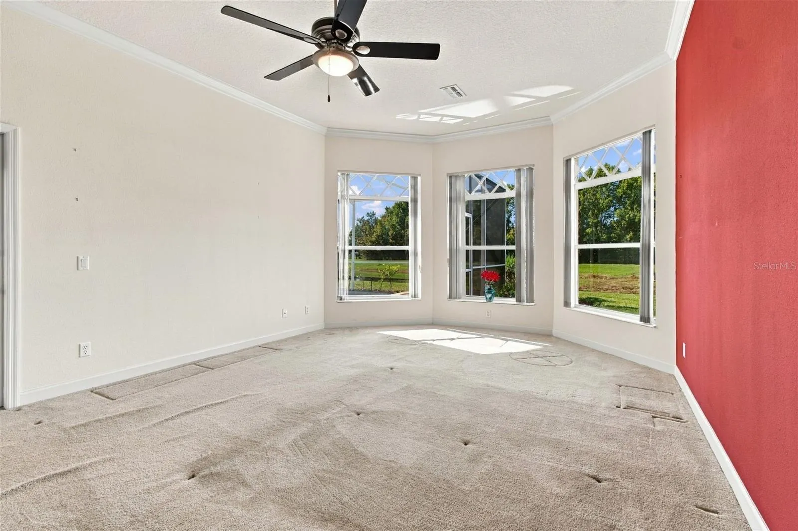 Oversized primary bedroom with three windows overlooking your heated spa, heated pool and conservation lot.