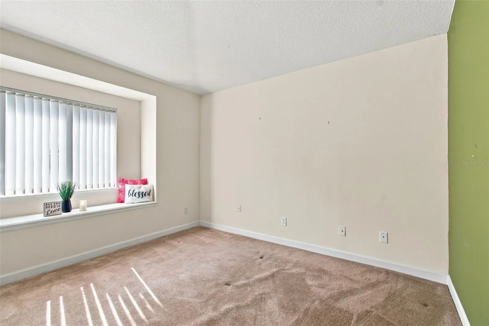 Bedroom 2 with window bench seating.