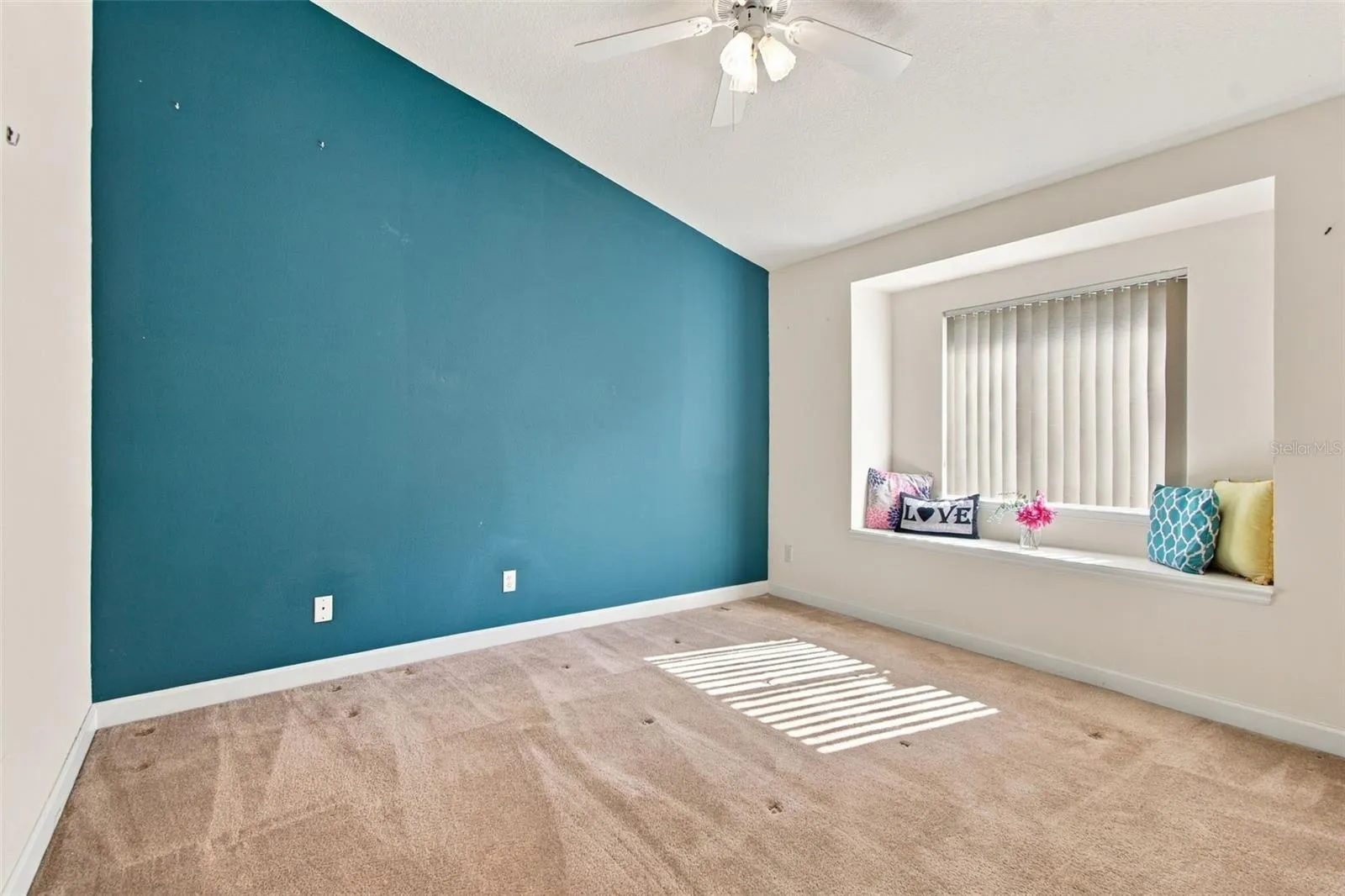 Bedroom 3 with window   bench seating.