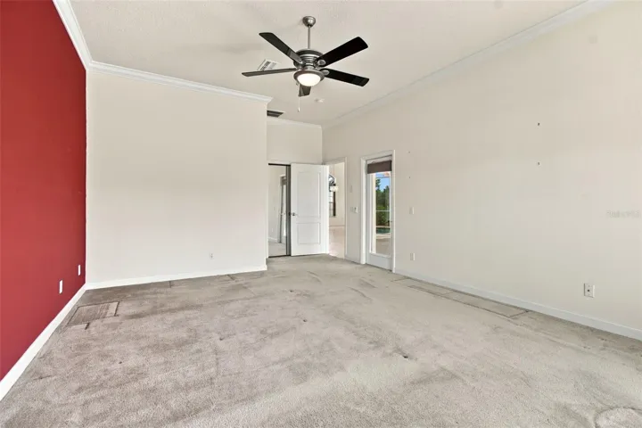 Your expansive primary bedroom offers easy access to your hot tub, pool, screened lanai and oversized conservation pond lot.