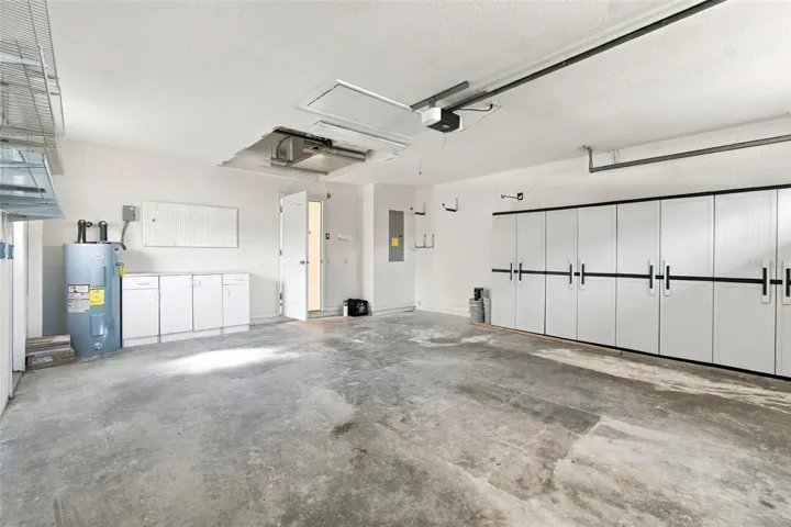 Your garage with wall storage units and a new garage system.