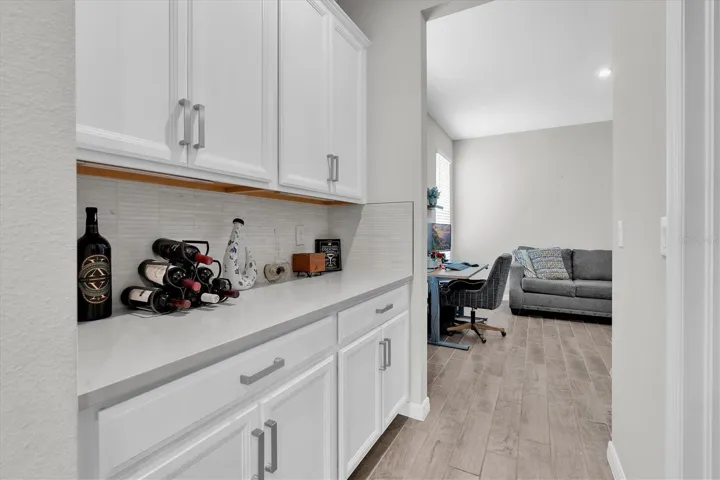 BUTLERS PANTRY ADJACENT TO LARGE WALK IN PANTRY