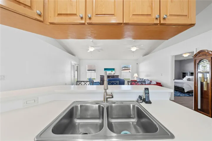Kitchen sink, living room and primary bedroom to the right.