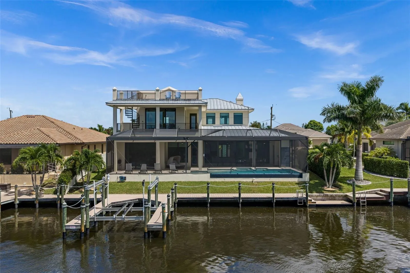 Closer Rear Aerial View showing 10,000 Lb Boat Lift and Kayak dock