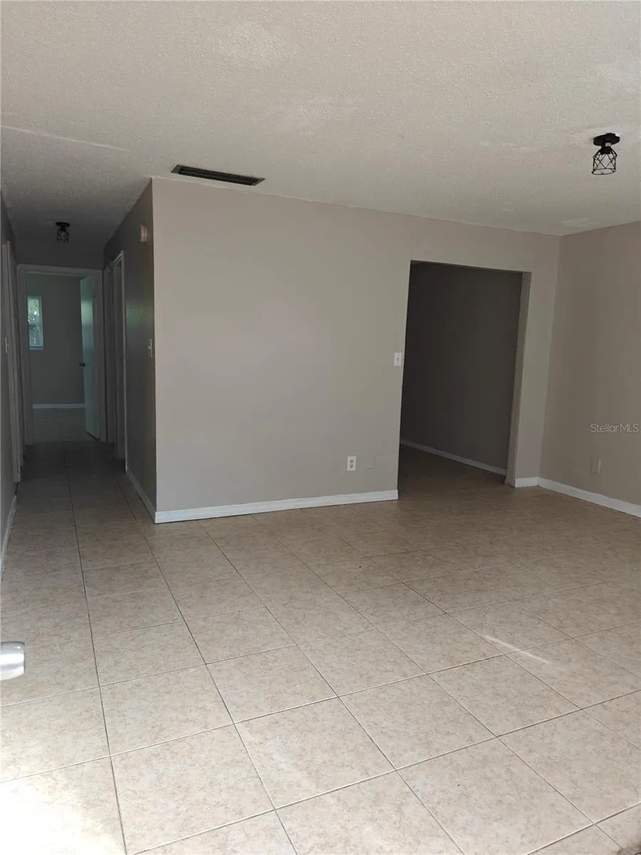 Side B Living room, small doorway to right is the den/office