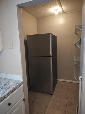 Side B Refrigerator placed inside open pantry