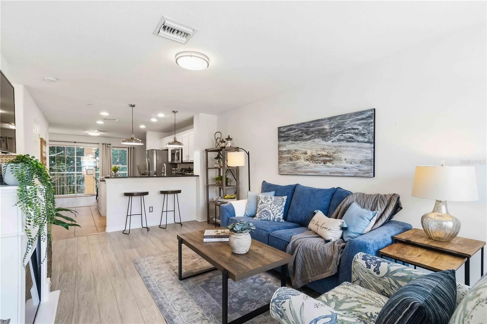 Living room with view into kitchen