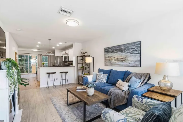 Living room with view into kitchen