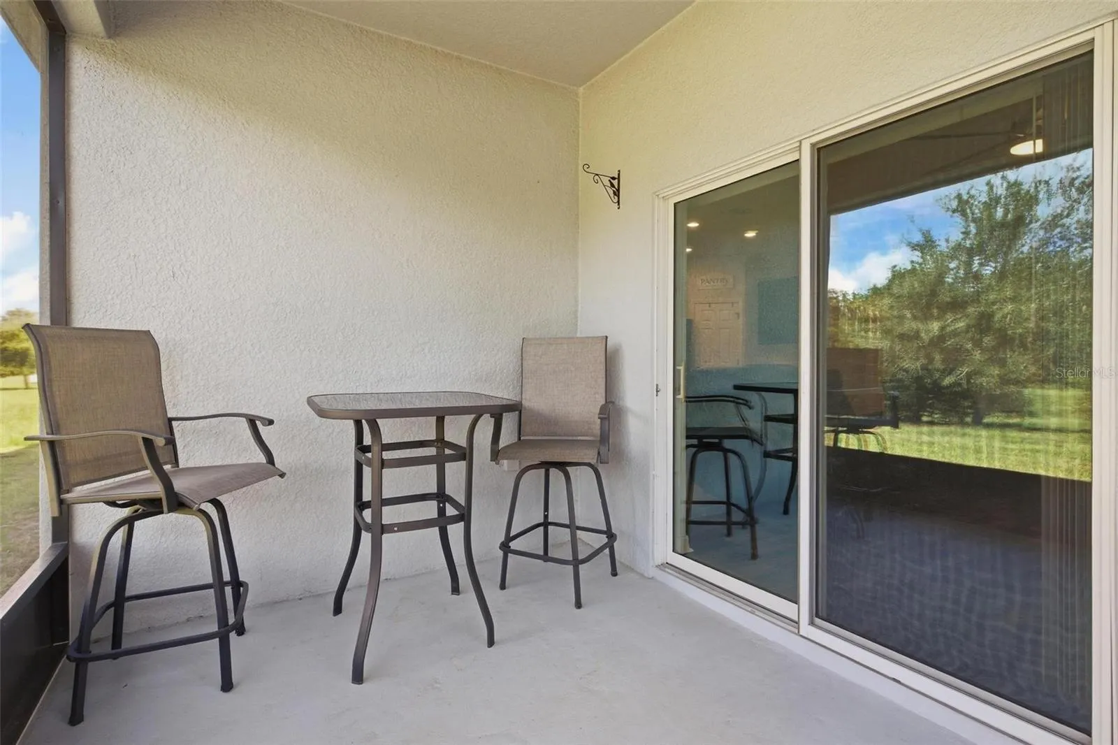Seating area on the back porch awaits BBQ!