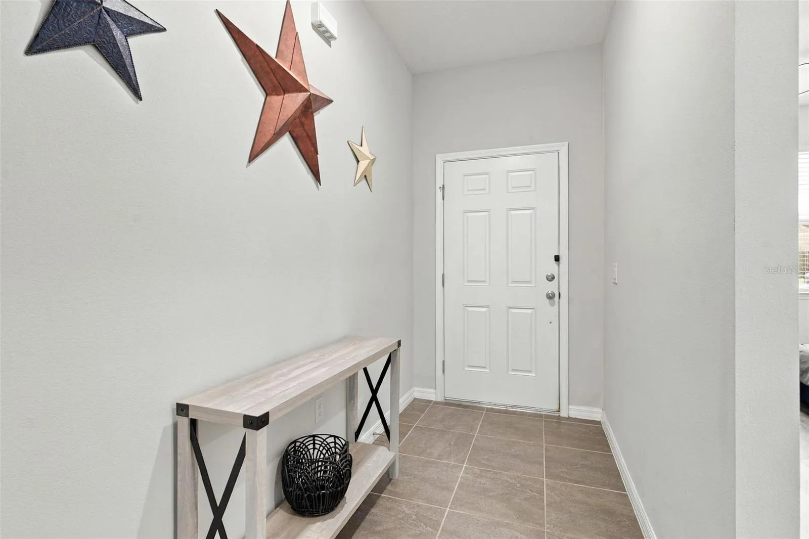 Bright and welcoming interior entryway.