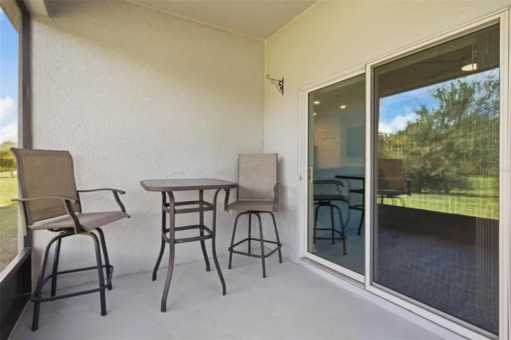 Seating area on the back porch awaits BBQ!