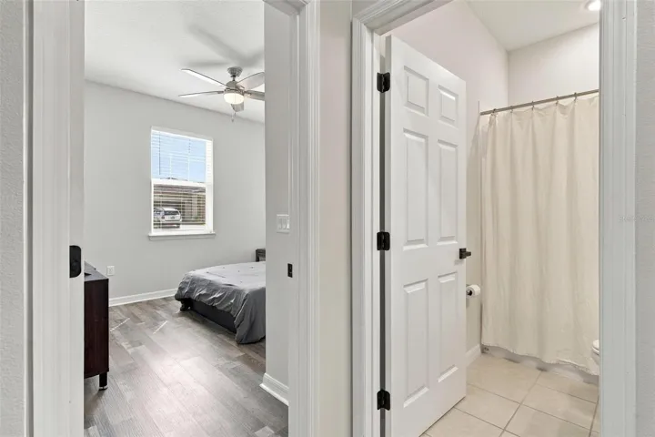 Bedroom 1, and bathroom with tile flooring!