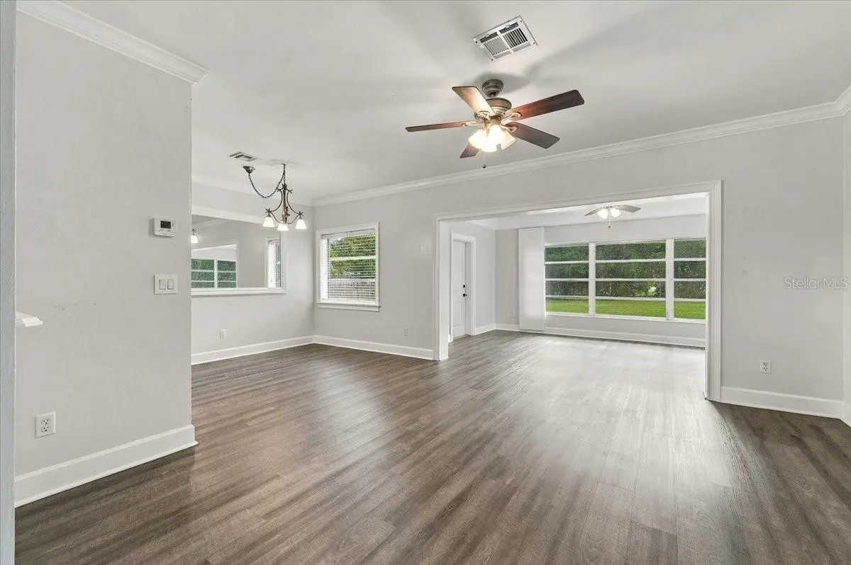 Living Room Looking to Sunroom and Dining Room